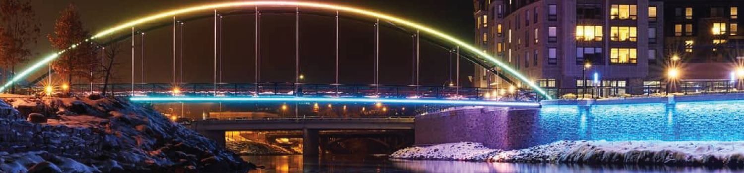 View of the Phoenix Park bridge in downtown Eau Claire, WI, lit up at night
