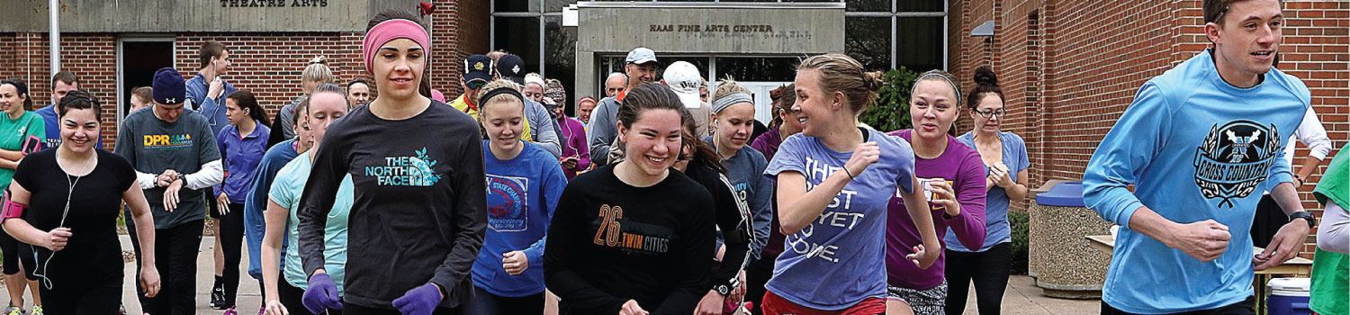 Students beginning a run outside Hass Fine Arts building on UW-Eau Claire campus
